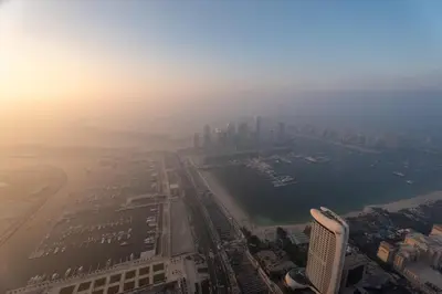 an aerial view of a city with a harbor and buildings at Veer Apartments - 87th Floor Penthouse Full Sea View 5 BHK in Dubai