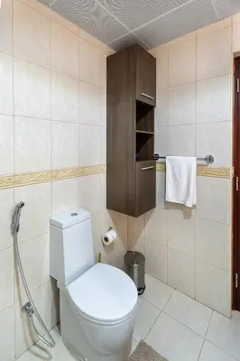a bathroom with a white toilet in a room at Veer Apartments - 87th Floor Penthouse Full Sea View 5 BHK in Dubai