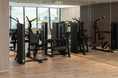 a gym with a lot of exercise equipment in a room at Stylish 1br Apt Jvc W Pool & Free Parking in Dubai