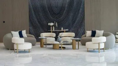 a living room with couches and chairs and a table at Stylish 1br Apt Jvc W Pool & Free Parking in Dubai