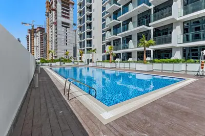 a swimming pool in the middle of a building at Elegant Studio with Pool Access & Private Terrace in Dubai