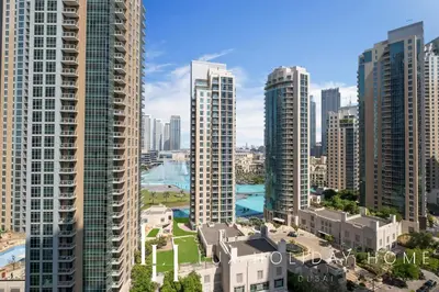 an aerial view of a city with tall buildings at LUX The Fountain View Suite in Dubai