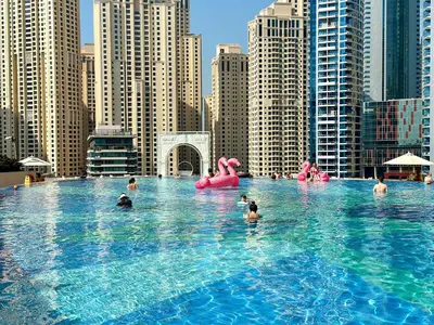 a group of people in a swimming pool in a city at Splendid Cozy Studio - Address Dubai Marina in Dubai