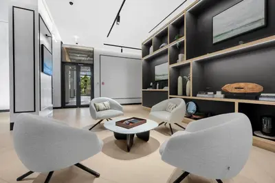 a living room with two chairs and a table at FIRST CLASS 2BR Serene Retreat in Wilton in Dubai
