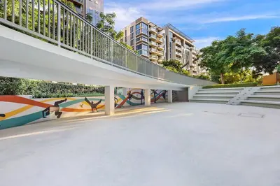 a building with a staircase and a mural at FIRST CLASS 2BR Serene Retreat in Wilton in Dubai