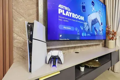 a video game controller sitting on a shelf with a tv at FIRST CLASS 2BR Serene Retreat in Wilton in Dubai