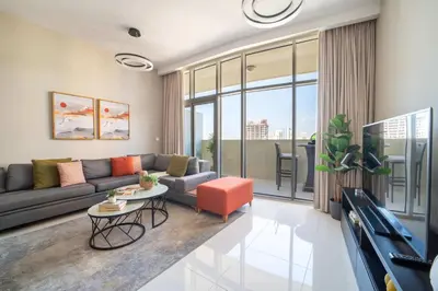 a living room with a couch and a table at Frank Porter - DAMAC Tower 108 - 1BR in Dubai