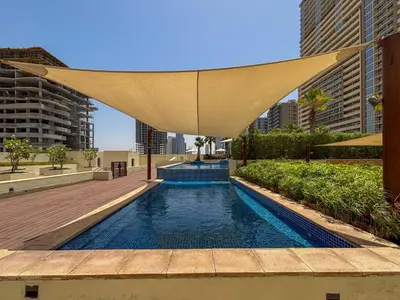 a swimming pool with a canopy in a city at Frank Porter - DAMAC Tower 108 - 1BR in Dubai