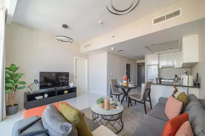 a living room with a couch and a table at Frank Porter - DAMAC Tower 108 - 1BR in Dubai