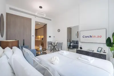 a bedroom with a large white bed in a room at TOP Location and Work and Chill near Miracle Garden in Dubai
