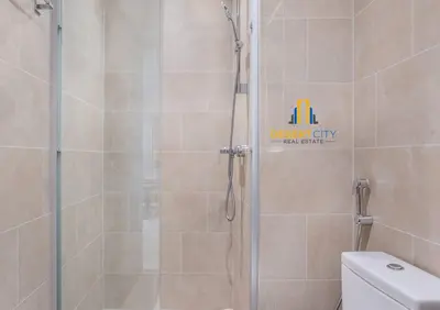 a shower stall in a bathroom with a toilet at Fully Furnished 2 Bed in Sobha Creek Vista Reserve, Hosted by Desert City Stays in Dubai