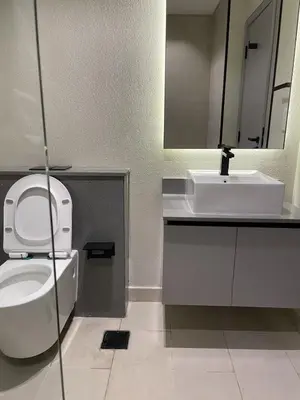 a bathroom with a white toilet and a sink at MAG 960 Stylish Luxury Apartment 6 Minutes to Burj Khalifa with Complimentary Guest Welcome Pack in Dubai