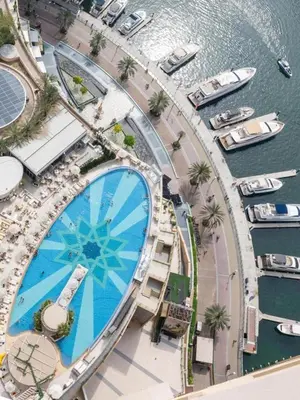 an overhead view of a pool at a marina at Upgraded Luxury Studio Apartment - Marina View - 5-Star Hotel Amenities in Dubai