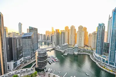 a view of a city with a river and buildings at Upgraded Luxury Studio Apartment - Marina View - 5-Star Hotel Amenities in Dubai