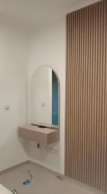 a bathroom with a mirror on the wall at 3 bedroom Villa Downtown in Dubai