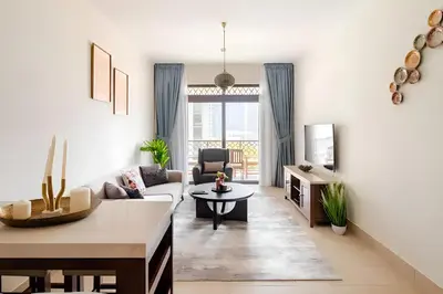 a living room with a couch and a table at 804 Yansoon 5 Amazing 1BR Apt Downtown Dubai in Dubai