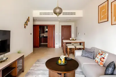 a living room with a couch and a table at 804 Yansoon 5 Amazing 1BR Apt Downtown Dubai in Dubai