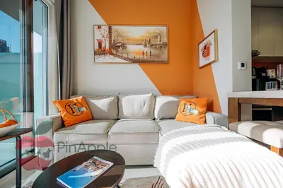 a living room with a couch and a table at 1BR With Burj Khalifa View and Accomodates 4 People in Dubai