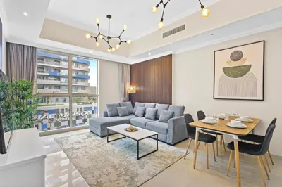 a living room with a couch and a table at Premium 1 bedroom Apartment near Dubai Mall in Dubai