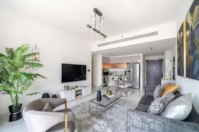 a living room with a couch and a table at Frank Porter - Marina Vista Tower 2 in Dubai