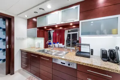 a kitchen with a sink and a counter top at Burj Khalifa & Fountain View- 5mn walk to Dubai mall -Luxurious & Stylish 1BDR Apartment in Dubai