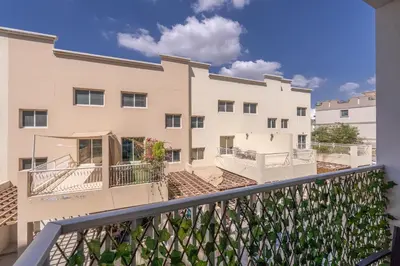 a view of a building from a balcony at Bright & Airy Studio in JVC in Dubai