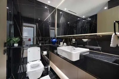 a bathroom with a white toilet and a sink at 2035-Inspired 1BR - JVC Dubai Near Burj Khalifa in Dubai