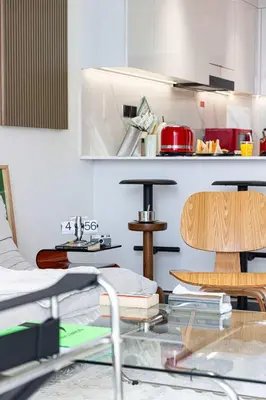 a kitchen with a glass table and a counter top at 2035-Inspired 1BR - JVC Dubai Near Burj Khalifa in Dubai