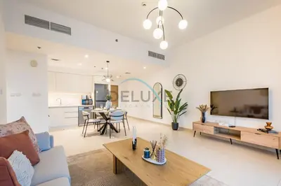 a living room with a couch and a table at Classy 1BR Apartment at Creek Horizon Tower 1, Dubai Creek Harbour by Deluxe Holiday Homes in Dubai