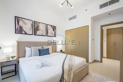 a bedroom with a large white bed in a room at Classy 1BR Apartment at Creek Horizon Tower 1, Dubai Creek Harbour by Deluxe Holiday Homes in Dubai