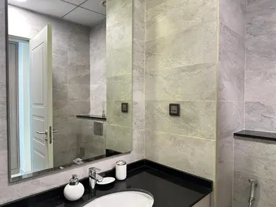 a bathroom with a sink and a mirror at Stunning 1-Bedroom in The Polo Residence, Meydan in Dubai