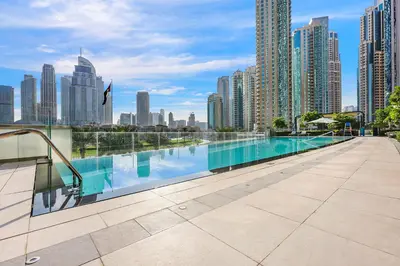 a swimming pool on the roof of a building at FIRST CLASS 1BR Heart of Tranquility in Dubai