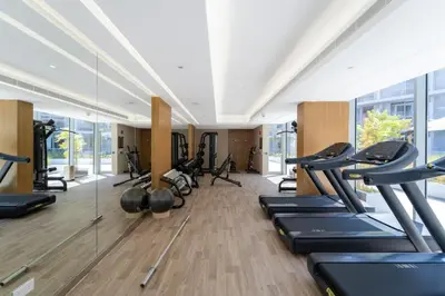 a gym with a bunch of treadmills and machines at Art of Modern Illumination in Dubai