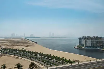 a view of a beach and a body of water at Luxurious Apartment, Dubai Creek Harbour - By Dustay in Dubai