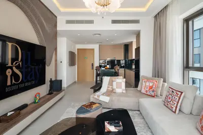 a living room with a couch and a table at Elegant Apartment for Relaxation, Creek Harbour - By DuStay in Dubai