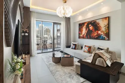 a living room with a large painting on the wall at Dubai Creek Poolside view Apartment - By DuStay in Dubai