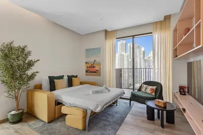 a hospital room with a bed and a large window at Stunning 1 bedroom Apartment w Burj Khalifa View in Dubai