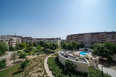 an aerial view of an apartment complex with a swimming pool at Frank Porter - Widcombe House 3 in Dubai