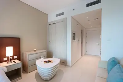 a living room with a tub in the middle of the room at Exquisite Studio near Nakheel Mall by Livbnb in Dubai