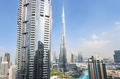 a view of a large city with tall buildings at Livbnb - 3BR Plus 1 with Burj and Fountain Views in Dubai