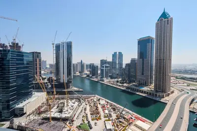 a view of a city with a river and buildings at Canalfront Gem 1BR in Zada Tower by Livbnb in Dubai