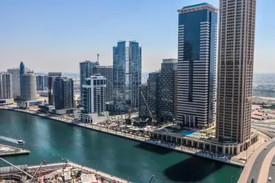 a view of a city with a river and buildings at Canalfront Gem 1BR in Zada Tower by Livbnb in Dubai