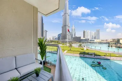 a balcony with a pool and a view of the city at Durrani Homes - The Luxe 3br with Burj Khalifa and Fountain View - third room without partition in Dubai
