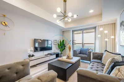 a living room with two couches and a television at Panoramic 2BR Apartment in Princess Tower, Dubai Marina by Deluxe Holiday Homes in Dubai