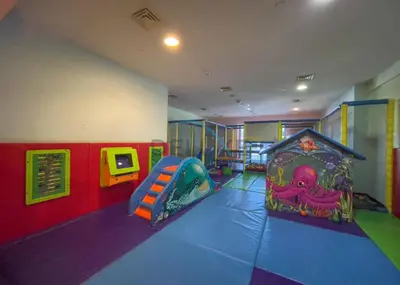 a childrens room with a slide and a play area at Panoramic 2BR Apartment in Princess Tower, Dubai Marina by Deluxe Holiday Homes in Dubai