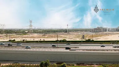 a highway with cars on it in a city at PREMIER STUDIO I Poolside in Dubai
