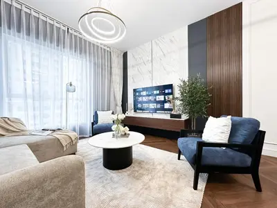 a living room with a couch and a table at Trophy Starlight Suites Lux Upgraded 1BR in Marina in Dubai