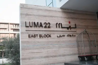 a sign on the side of a building with a cage at Luma Escape Dubai in Dubai