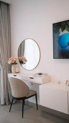 a desk with a mirror and a chair in a room at Luma Escape Dubai in Dubai