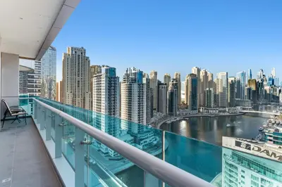 a balcony with a view of a city at Elegant One Bed Apartment - Panoramic Marina Views - Near JBR & Beach in Dubai